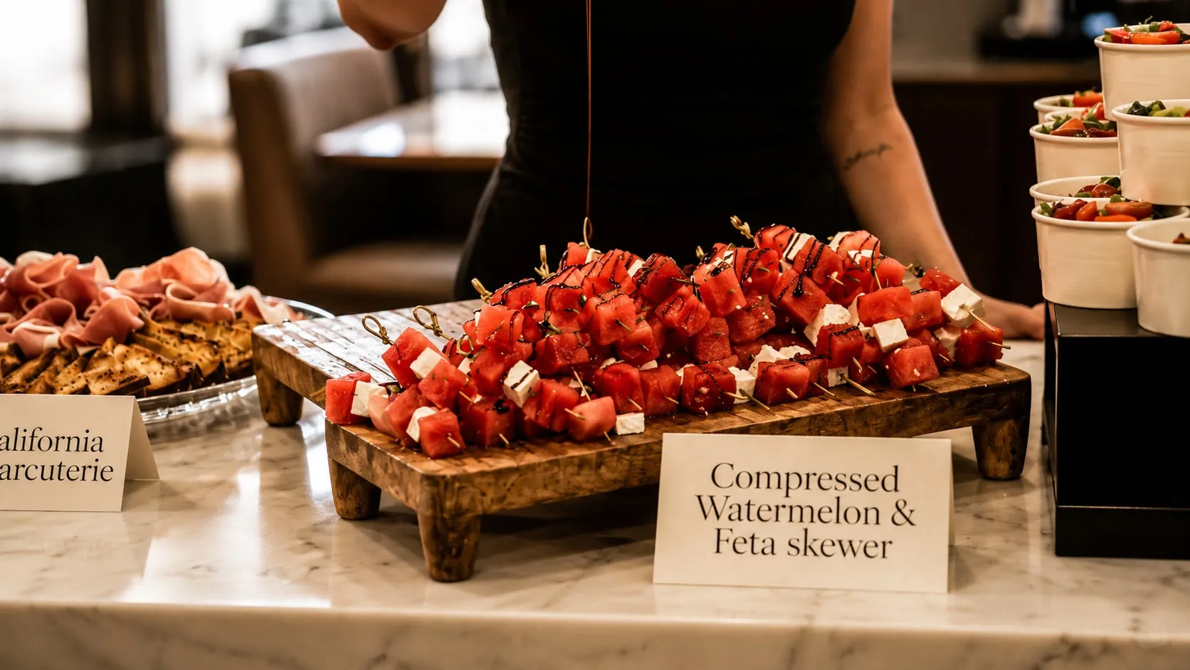Compressed watermelon & feta skewers beside California charcuterie