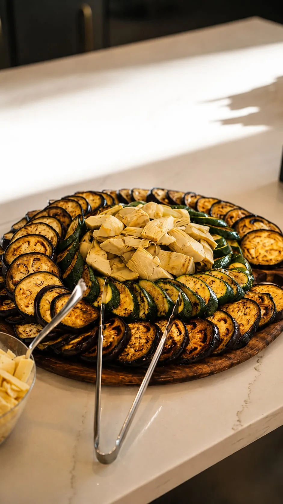 An overhead grazing platter with a vegetable wreath and dip